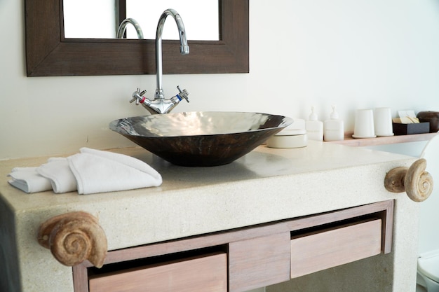 Counter with sink and shampoo and body wash in the bathroomInterior designvintage bathroom style