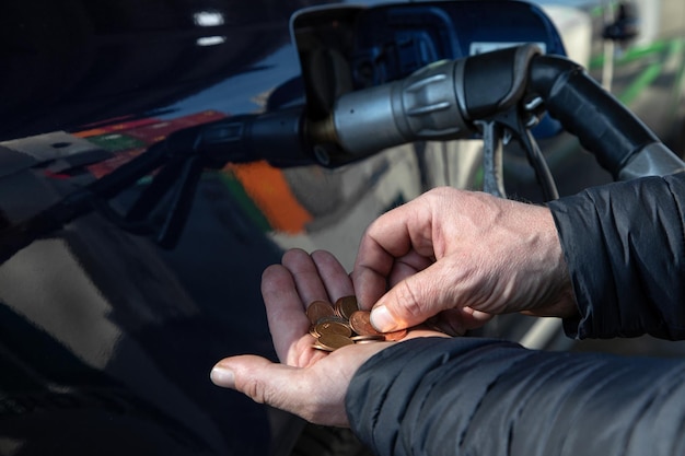 Photo counting small money for refueling the car