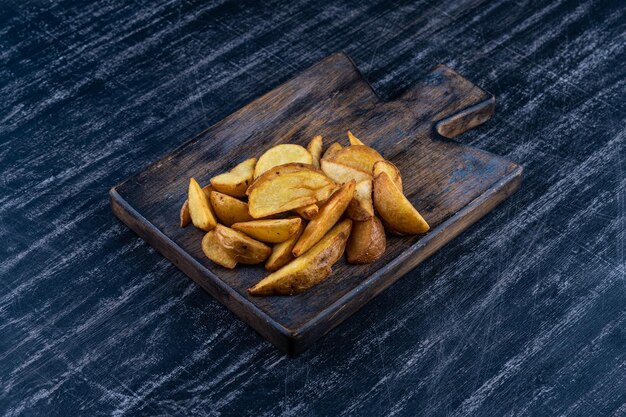 Country fried potatoes on a wooden platter