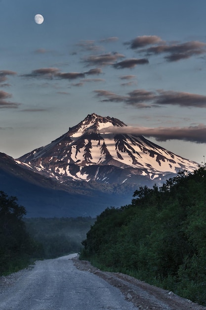 Country road to volcano at night in moonlight