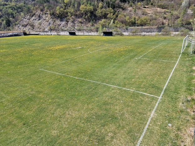 country soccer field with flowers on sunny day