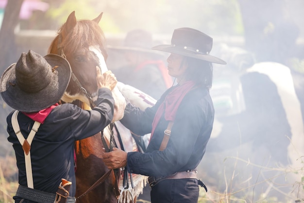 On the countryside a cowboy walks his horse Nature notion of freedom