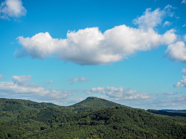 Countryside landscape against blue sky and clouds