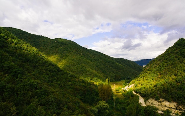 Countryside landscape against mountain range