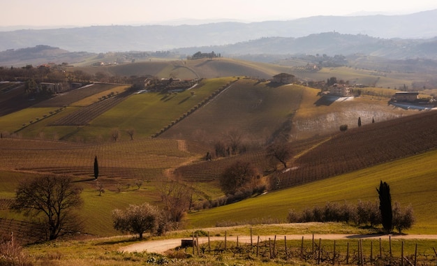 Countryside landscape in autumn agricultural fields among hills