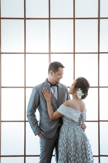 Coupla wearing wedding dress and suit