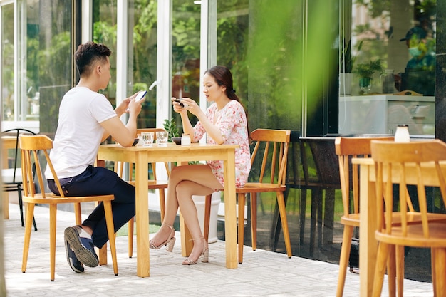 Couple addicted to social media