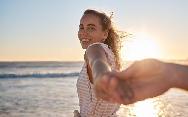 Couple at beach holding hands and love at sunset travel together and adventure with romantic vacation portrait Relationship with care ocean and peace support or trust and bonding with mockup