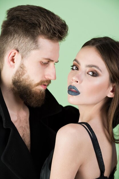 Couple of bearded man woman in black with fashionable makeup