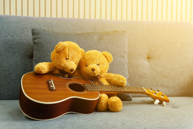 Couple bears playing guitar at home. Love concept.