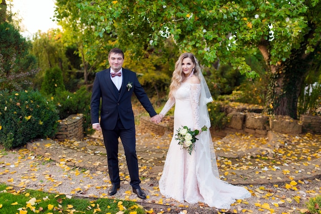 Couple of beautiful newlyweds in the garden