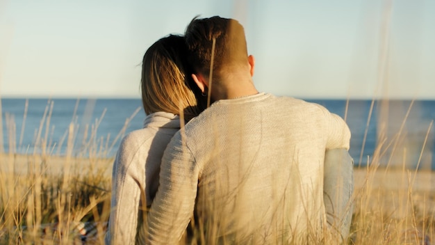 couple of boy and girl are sitting on a carpet