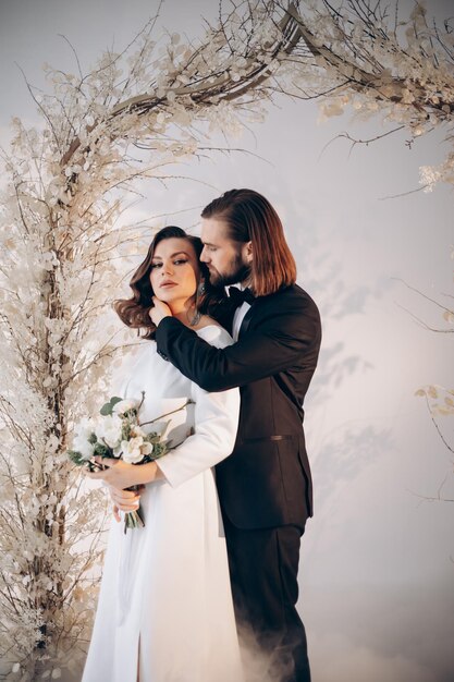 couple bride and groom on wedding day together in bright interior