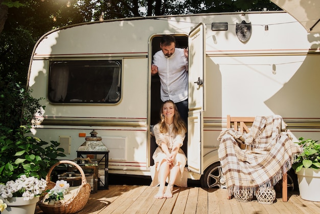 Couple camping and travelling by camper van