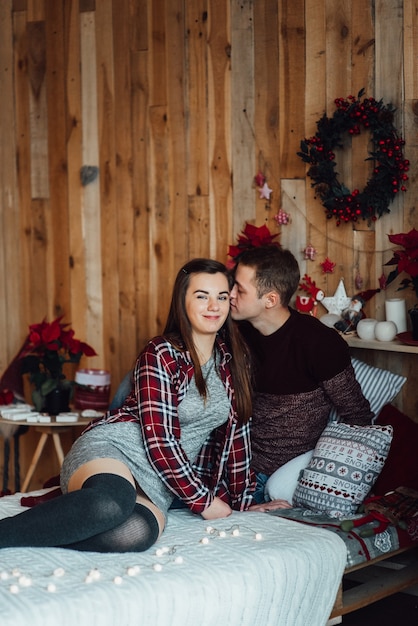 Couple celebrate Christmas in a warm atmosphere at home