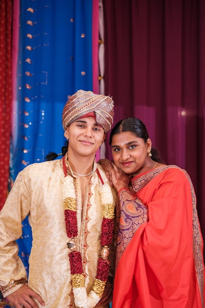 Couple celebrating a religious event with their family and their god Concept tradition