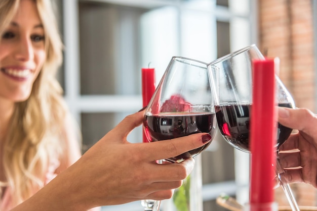 couple celebrating Valentine's day toasting in a dinner at home