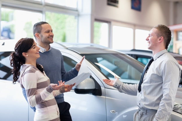 Couple chatting with a salesman