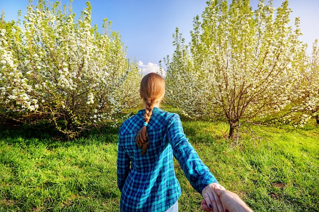 Couple in cherry blossom garden