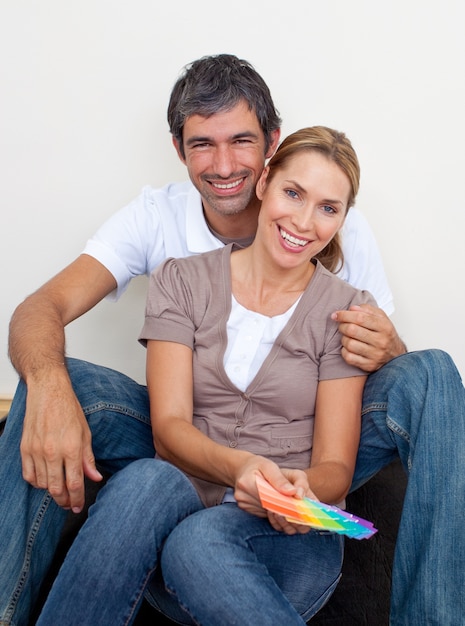 Couple choosing color to paint their new house