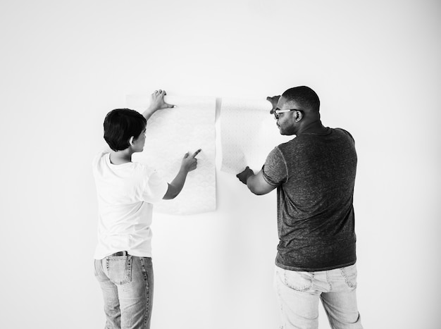 Couple choosing house wallpaper