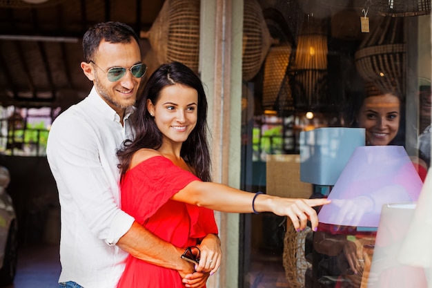 Couple choosing a lamp in a shop