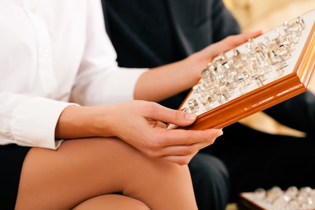 Couple choosing a ring at the jeweler