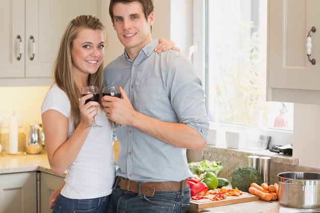 Couple clinking wine glasses