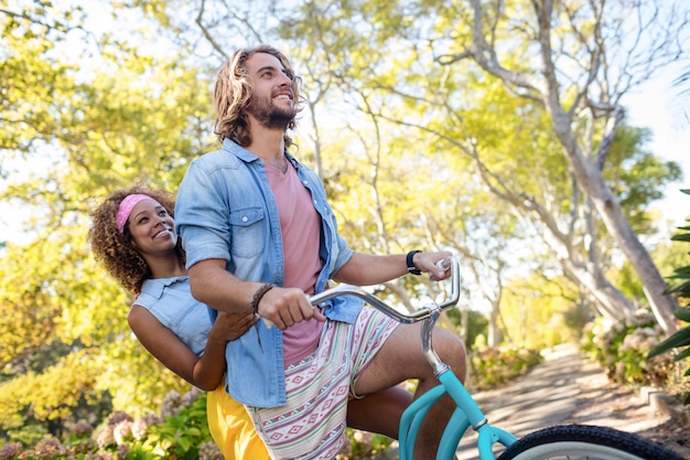 Couple cycling in the park