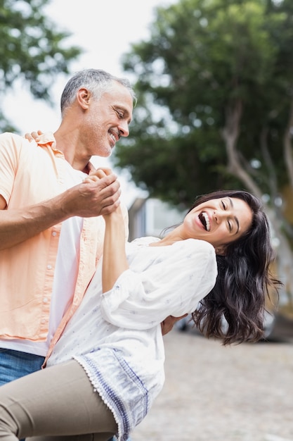 Couple dancing on street