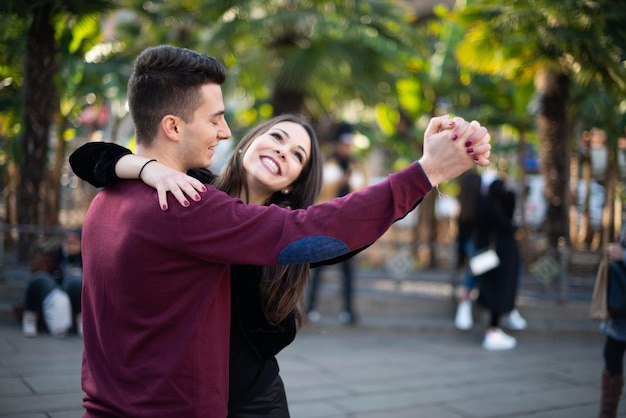 Couple dancing together in the middle of a city