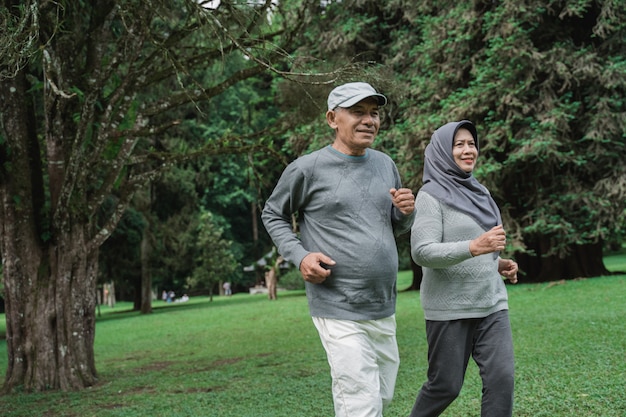 Couple doing exercising by running in the garden