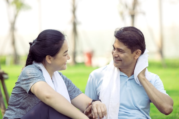 Couple doing stretching exercise after jogging