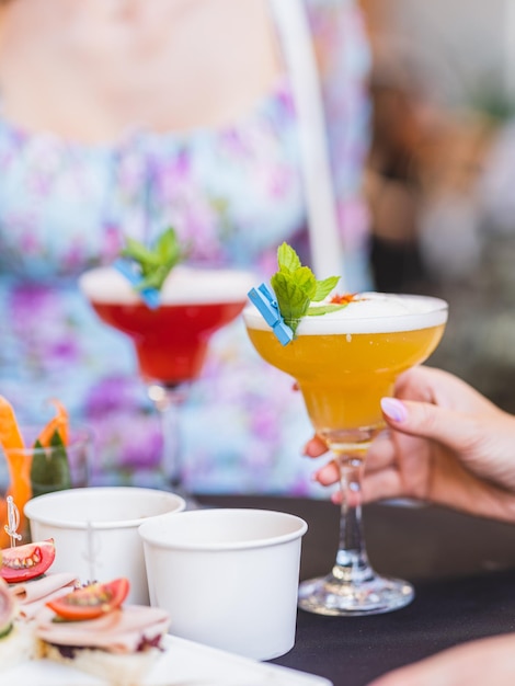 A couple drinking cocktails at a celebration