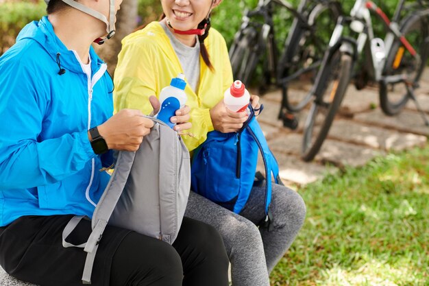 Couple Drinking Water after Ride