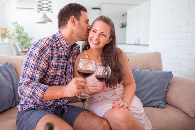 Couple drinking wine at home