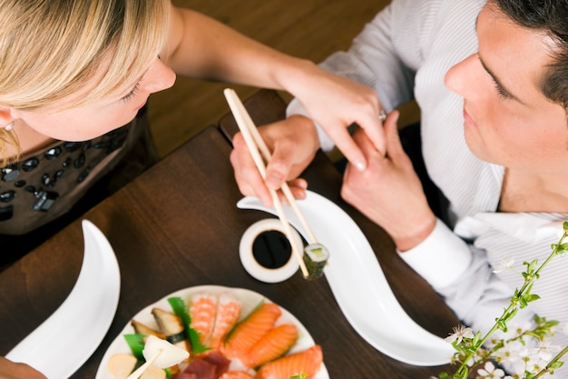 Couple eating Sushi