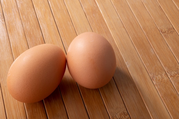 Couple eggs on wooden table