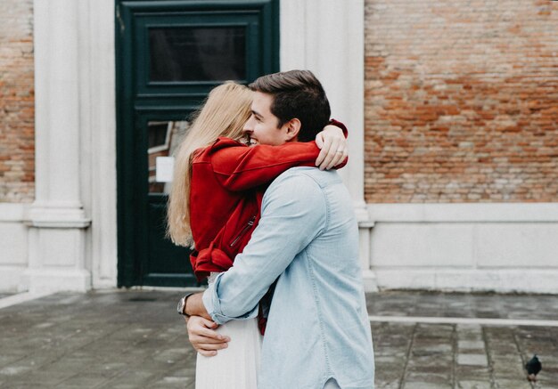 Couple embracing in city