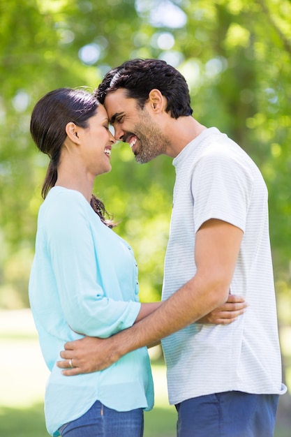 Couple embracing each other in park