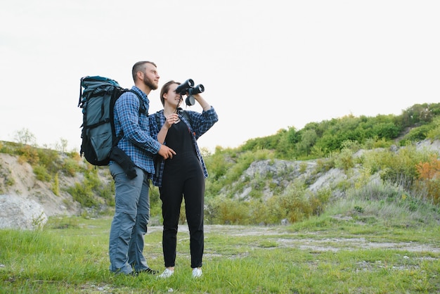 Couple enjoying beautiful views on the mountains