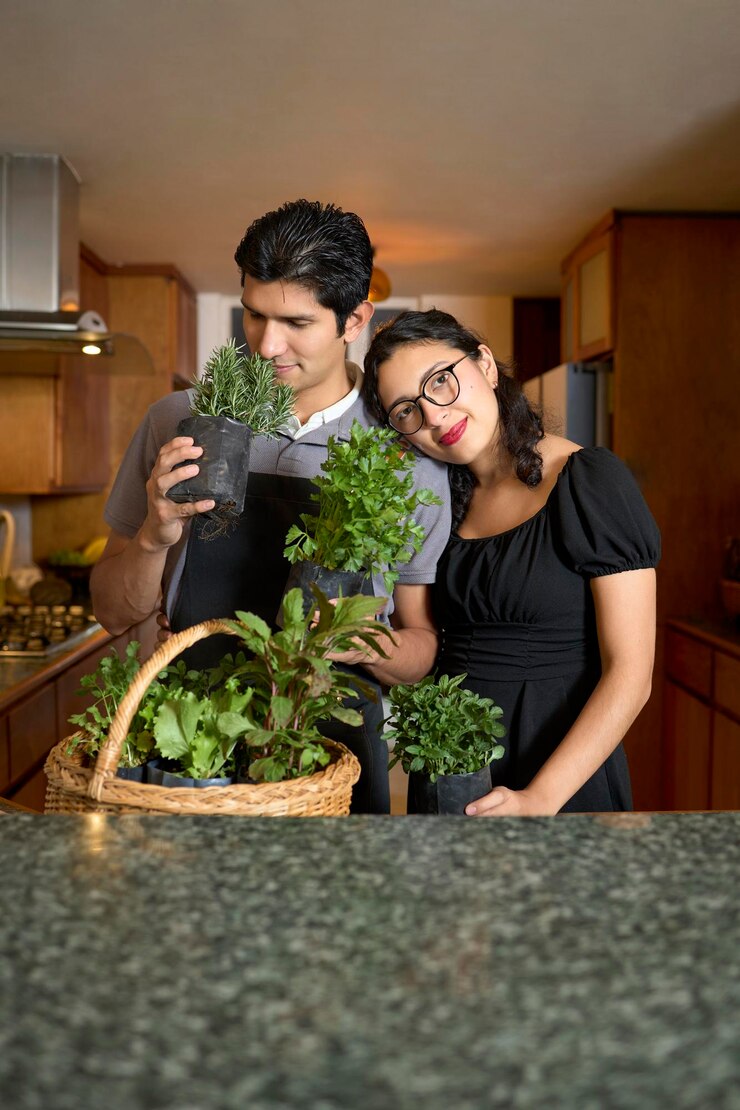 फोटो couple enjoying fresh homegrown herbs in the kitchen