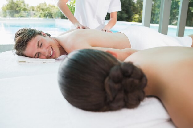 Couple enjoying massage at health farm