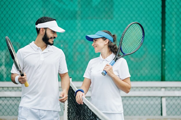 Couple enjoying playing tennis