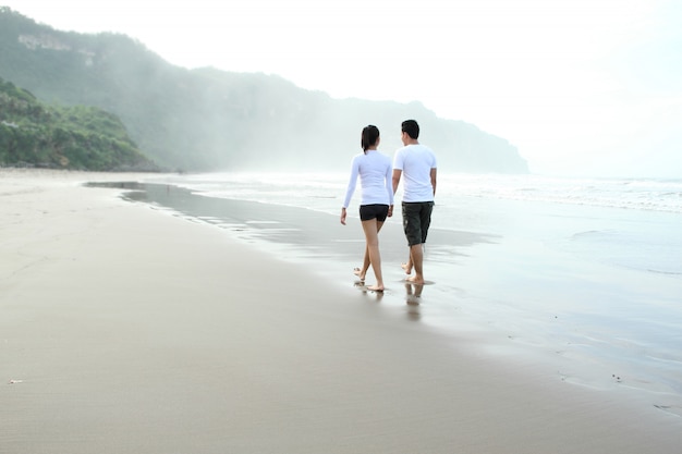 Couple enjoying a summer vacation on the beach