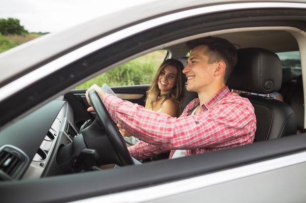 Couple enjoying travelling in the car