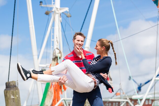 Couple enjoying vacation at German north sea ship pier