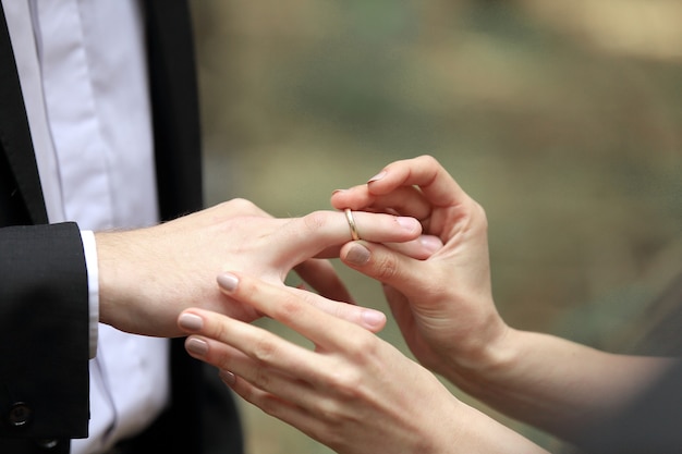 couple exchanging wedding rings