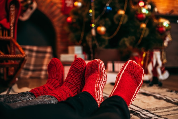 Couple feet in merry red socks, christmas