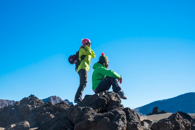 Couple of female people enjoying the outdoor sport leisure actiity at the mountain 